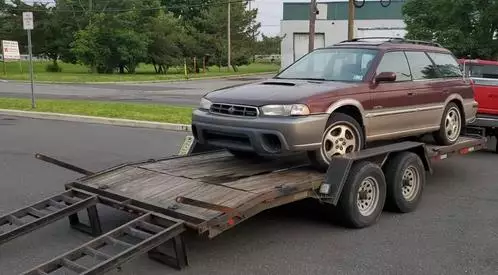 Learn How to Load a Disabled Vehicle on a Car Trailer Safely
