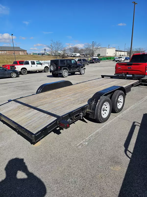 18' Flatbed Trailer with heavy duty ramps.