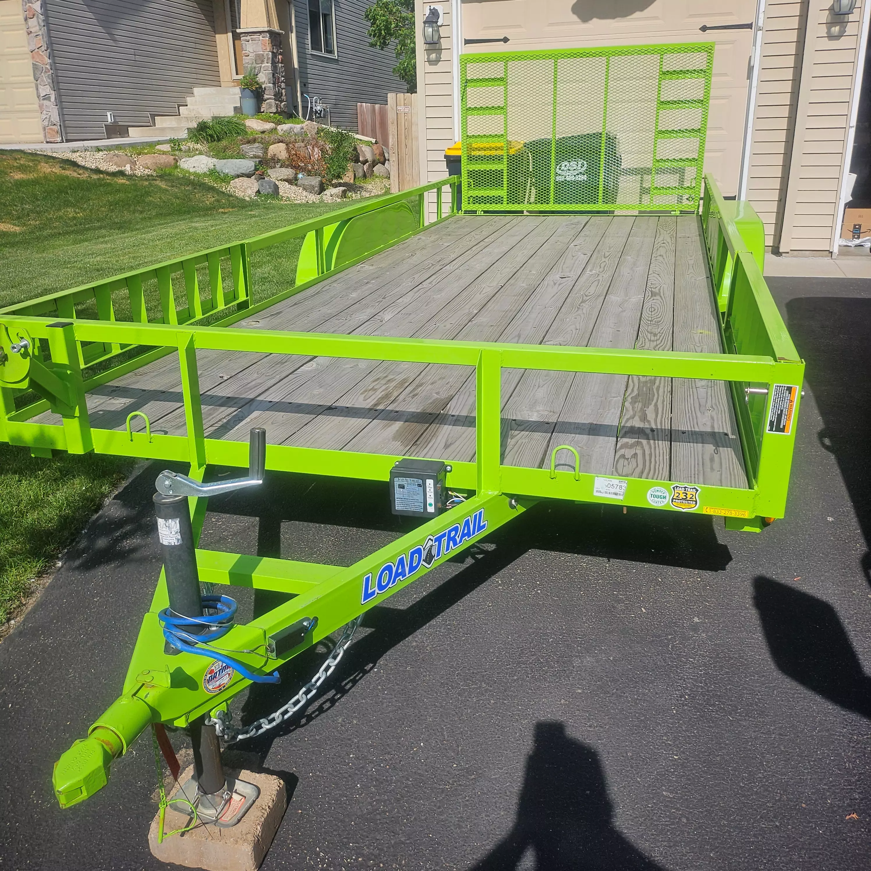 18' Utility Trailer with rear gate and side ramps.